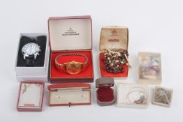 An assortment of costume jewellery and watches.