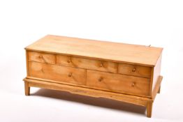 A mid-century Gordan Russell style chest on stand.