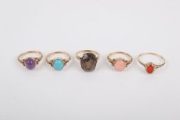 Five 9ct gold rings variously set with semi precious stones.