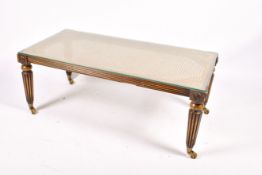 A 20th century French Louis XVI style cane top coffee table.