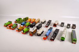 An assortment of diecast vehicles and model trains.