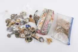 An assortment of costume jewellery and watches.