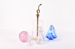 A group of five assorted glass items. Including a Boots Chemist bottle, a whisky noggin, etc.