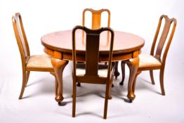 A late 19th century mahogany extendable dining table and a set of four Queen Anne style dining