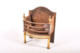 A cast iron fire basket grate with brass finials.