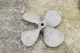 A four blade brass marine boat propellor.