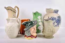 Seven 19th century and later English pottery pitchers.