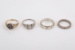 Four 9ct gold dress rings.