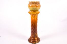 A 20th century pottery jardiniere and pedestal.