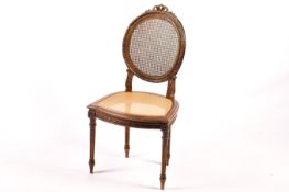 A Louis XVI style mahogany framed chair.