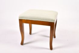 A contemporary John Tanous Ltd light blue upholstered stool.