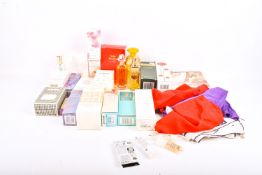 A collection of assorted cosmetics. Including perfume and scarves, some sealed, etc.