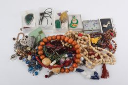 A box of assorted costume jewellery. Including assorted beaded necklaces, quartz pendants, etc.