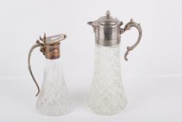 A large pewter mounted carafe and a silverplated example. The first of moulded glass, height 35.