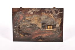 Japanese lacquer panel depicting houses in the landscape.