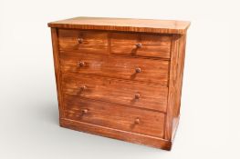 A 20th century satinwood chest of drawers.