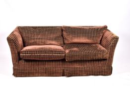 A contemporary two-seater low back sofa. Having feather cushions.