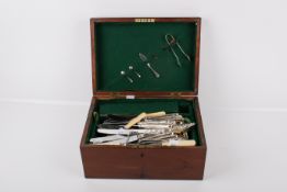 A part canteen of Smith Seymour silverplated cutlery and other. In an oak box.