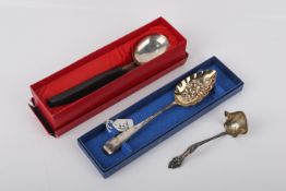 Four pieces of silver or white metal flatware.