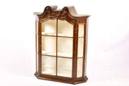 A Dutch style walnut swan neck cabinet.