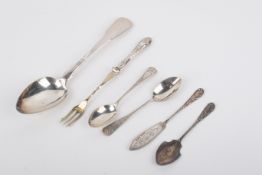 An assortment of silver and white metal flatware.