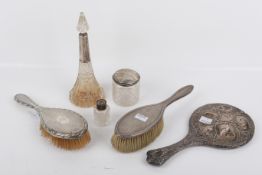 Six silver backed or mounted vanity accessories.