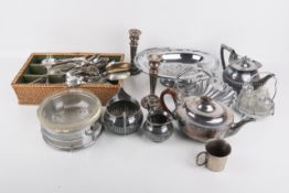 A box of assorted silver and silverplated items.