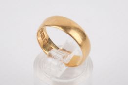 A 22ct gold wedding band. Hallmarked, size L/M, weight 3.5g.
