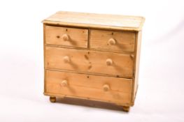 A vintage pine chest of drawers.