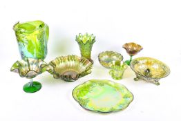 A collection of green carnival glassware.