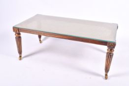 A 20th century French Louis XVI style cane top coffee table.