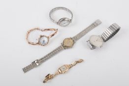 Five assorted wristwatches.