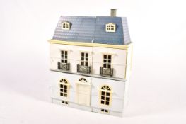 A French style doll's house and contents.