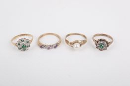 Four assorted dress rings.