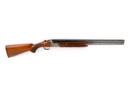 A Miroku over and under 12 gauge ejector shotgun. 2 3/4 inch chambers, 26 inch barrels.