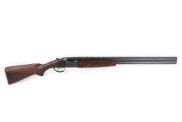 Baikal 12 bore over and under shotgun. S/n P06334, quarter and three quarter fixed chokes.