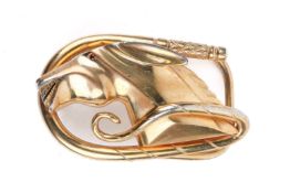 A gold plated 'horse head' belt buckle.