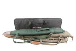 A collection of assorted gun bags mostly padded canvas type.