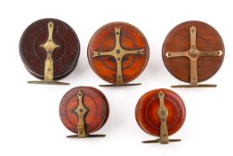 Five wooden vintage centre pin fishing reels. Including two 4'' Starbacks, etc.