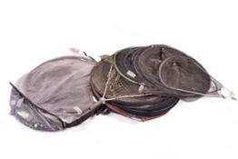 A collection of assorted fishing keep nets and landing nets.