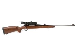 BSA 243 bolt action rifle with scope. S/n 11R6255 with a three shot magazine and scope.