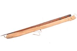 A vintage four piece fishing rod.