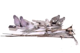 Two boxes of hollow pigeon decoys.