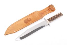 An 'Original Bowie Knife' with antler handle in a tan leather scabbard. Total length 38cm.