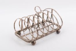 A George V Stirling silver hallmarked toast rack. London, 1910, 'D&F'.