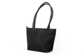 A Franchetti Bond black leather handbag.