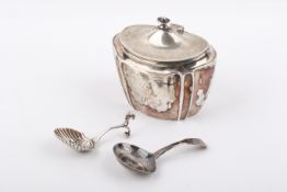 A Victorian silver tea caddy and two caddy spoons.