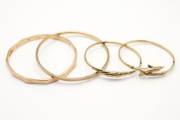 Four 9ct gold bangles. One in the form of a pair of dolphins, all hallmarked, gross weight 41.3g.