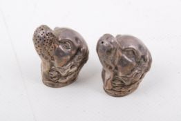 A pair of novelty silver salt and pepper pots modelled as dog heads, stamped 925. H45mm.