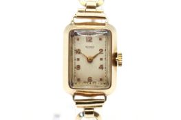 A 9ct gold Rotary cocktail watch. Gilt Arabic numerals to the rectangular cream face, case 2.